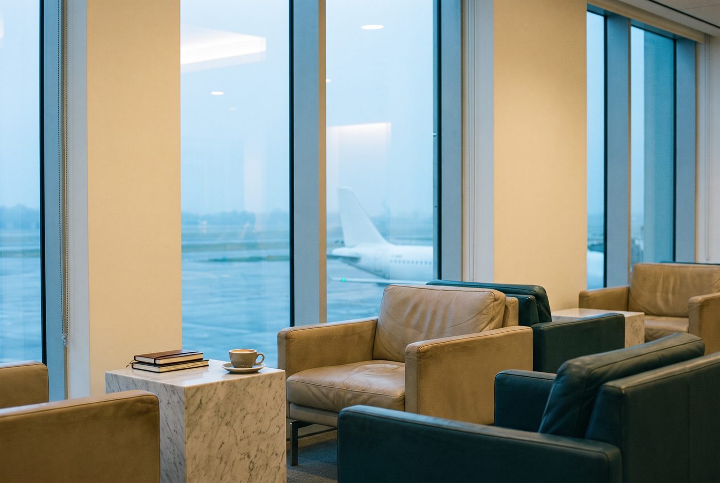 A quiet airport business lounge at dawn